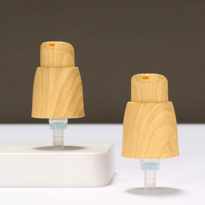 Außenspringluftlose 0,25cc Plastiklotionspumpe Handlotionspumpe mit Holzkorn